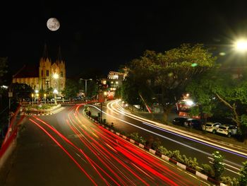 Light trails on street in city at night