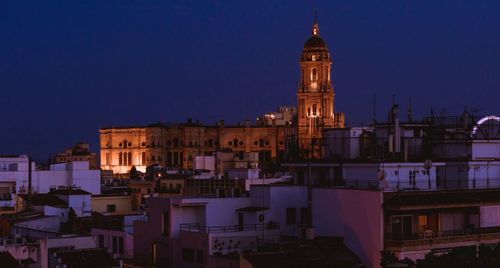 Buildings in city at night