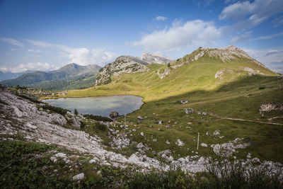 Scenic view of lake and mountains against sky