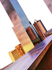 Low angle view of skyscrapers against clear sky