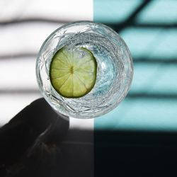 Close-up of lemon in glass
