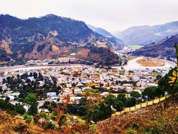 High angle view of townscape and mountains