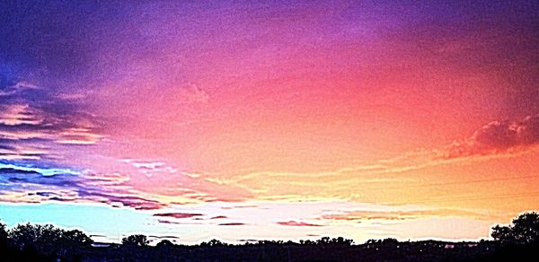 Scenic view of landscape against sky at sunset