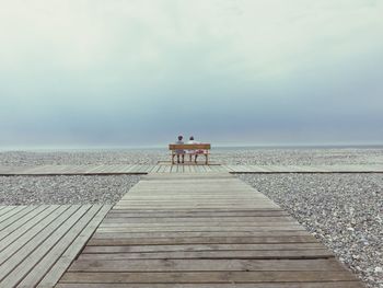 Pier over sea against sky