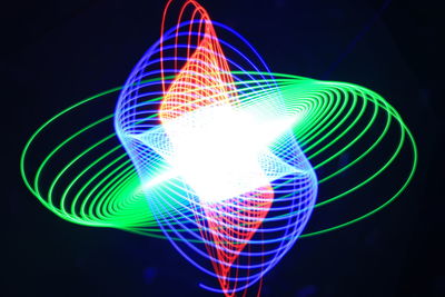 Low angle view of light trails at night