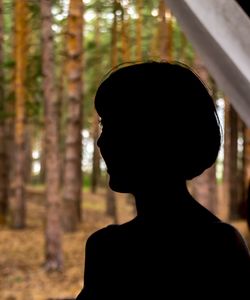 Silhouette woman in forest