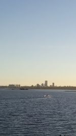 Scenic view of river against clear sky during sunset