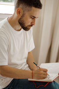 Young man working at home