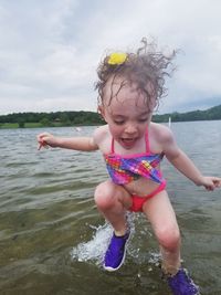 Cute girl enjoying in sea