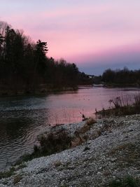 Scenic view of lake against sky during sunset