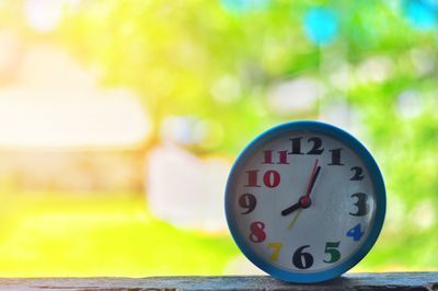 Close-up of clock on table