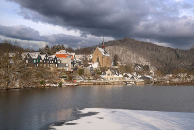 Houses and buildings against sky