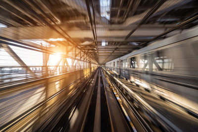 Blurred motion of railroad tracks at railway station