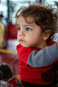 Close-up of cute boy looking away