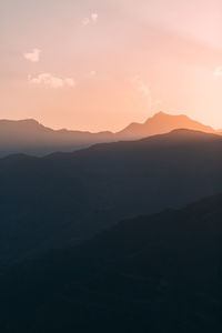 Scenic view of mountains against sky during sunset