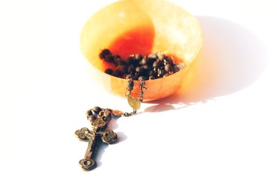 Close-up of orange fruit against white background