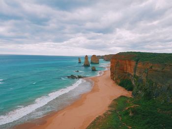 View of beach against cloudy sky
