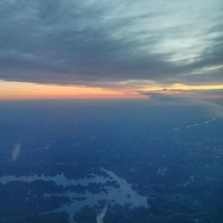 Aerial view of landscape against cloudy sky