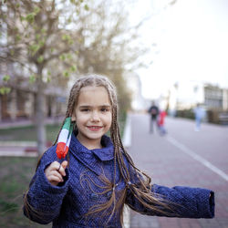 Portrait of girl standing on street