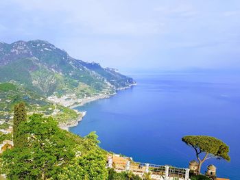 High angle view of sea and buildings against sky