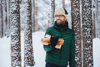 Full length of a man standing in snow