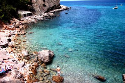 High angle view of rocks in sea