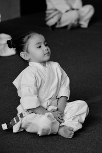 Girl sitting at karate classes