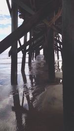 Silhouette of below bridge on beach