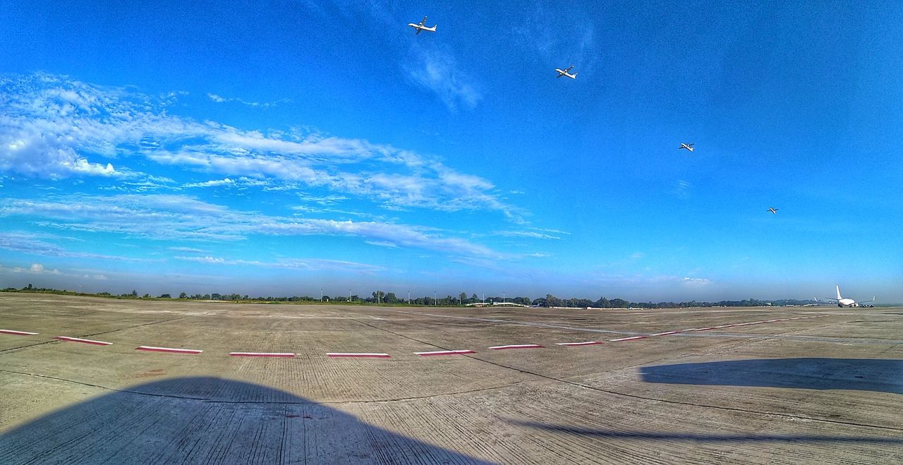 airplane, transportation, air vehicle, sky, airport, airport runway, blue, flying, day, no people, outdoors, landscape, runway