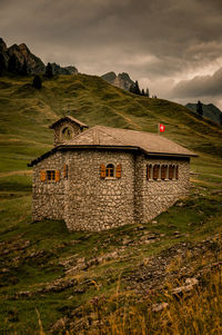 House on field against sky