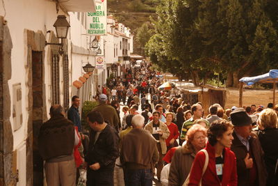 High angle view people walking on street by building