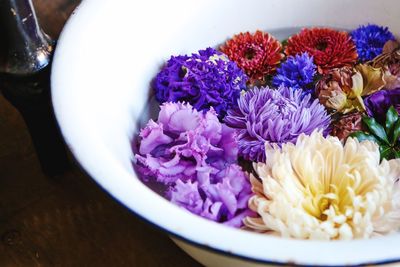 Close-up of flowers in bowl on table