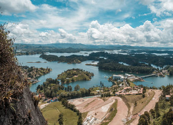 High angle view of city and sea against sky