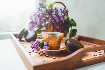 Close-up of blue flowers in bowl on table