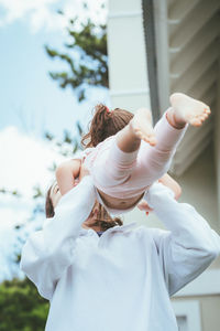 Woman playing with daughter