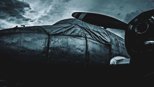 Low angle view of old car against sky