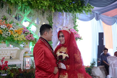 Young couple standing in park