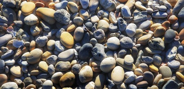 Full frame shot of pebbles on beach