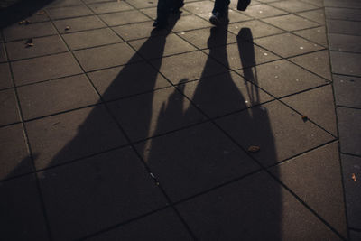 Low section of people walking on footpath