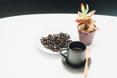 Close-up of coffee served on table against white background