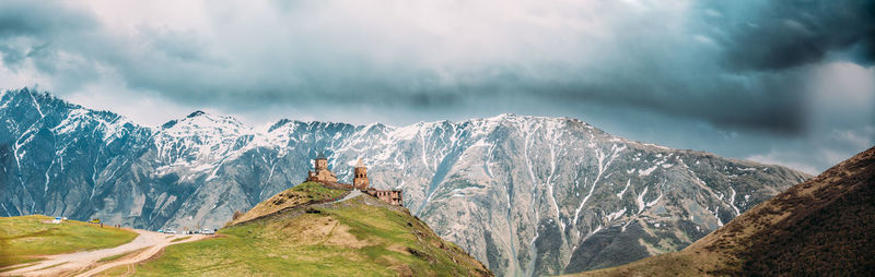 Panoramic view of snowcapped mountains against sky