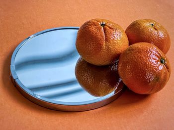 High angle view of fruits in plate on table