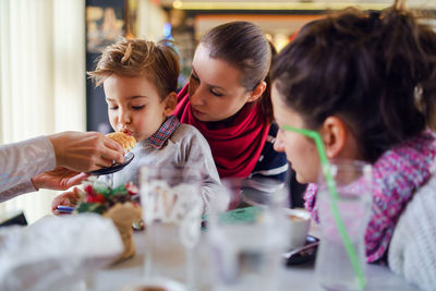 Family having food in restaurant