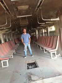 Portrait of man standing on seat