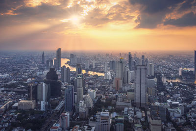 Aerial view cityscape of modern city on sunset in bangkok, thailand.