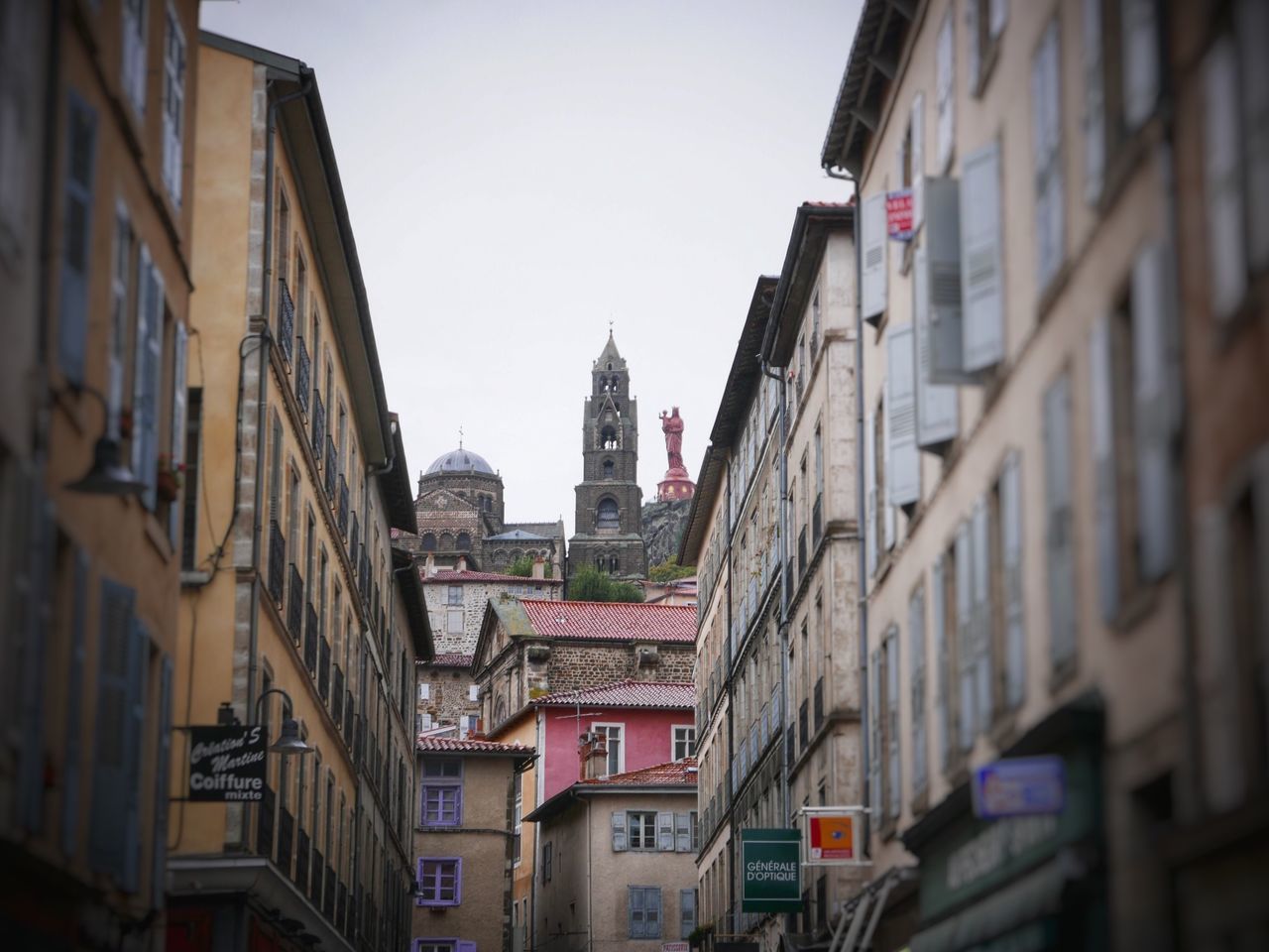 building exterior, architecture, built structure, clear sky, city, residential building, residential structure, low angle view, building, residential district, tower, sky, day, old town, outdoors, city life, church, travel destinations, window, no people