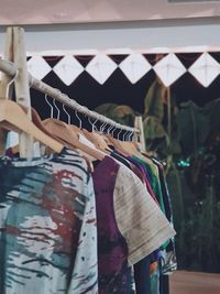 Close-up of clothes hanging on rack at store