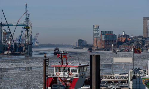 People ferries and the museum ship in the port of hamburg hampered by ice floes, drift ice