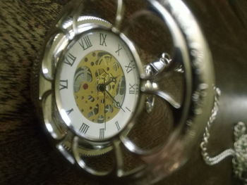 Close-up of clock on table