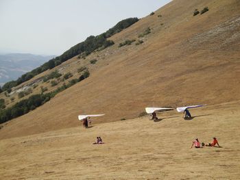 People on field against sky